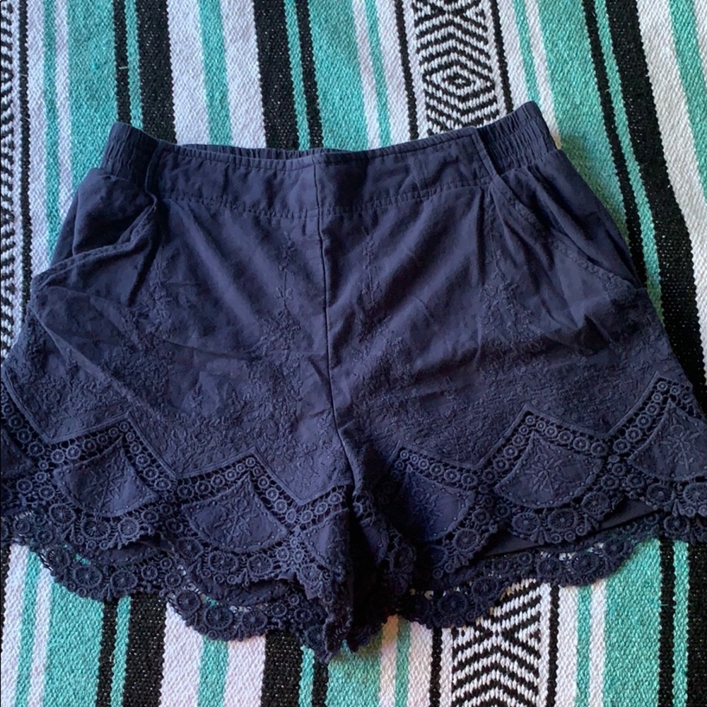A pair of navy blue shorts